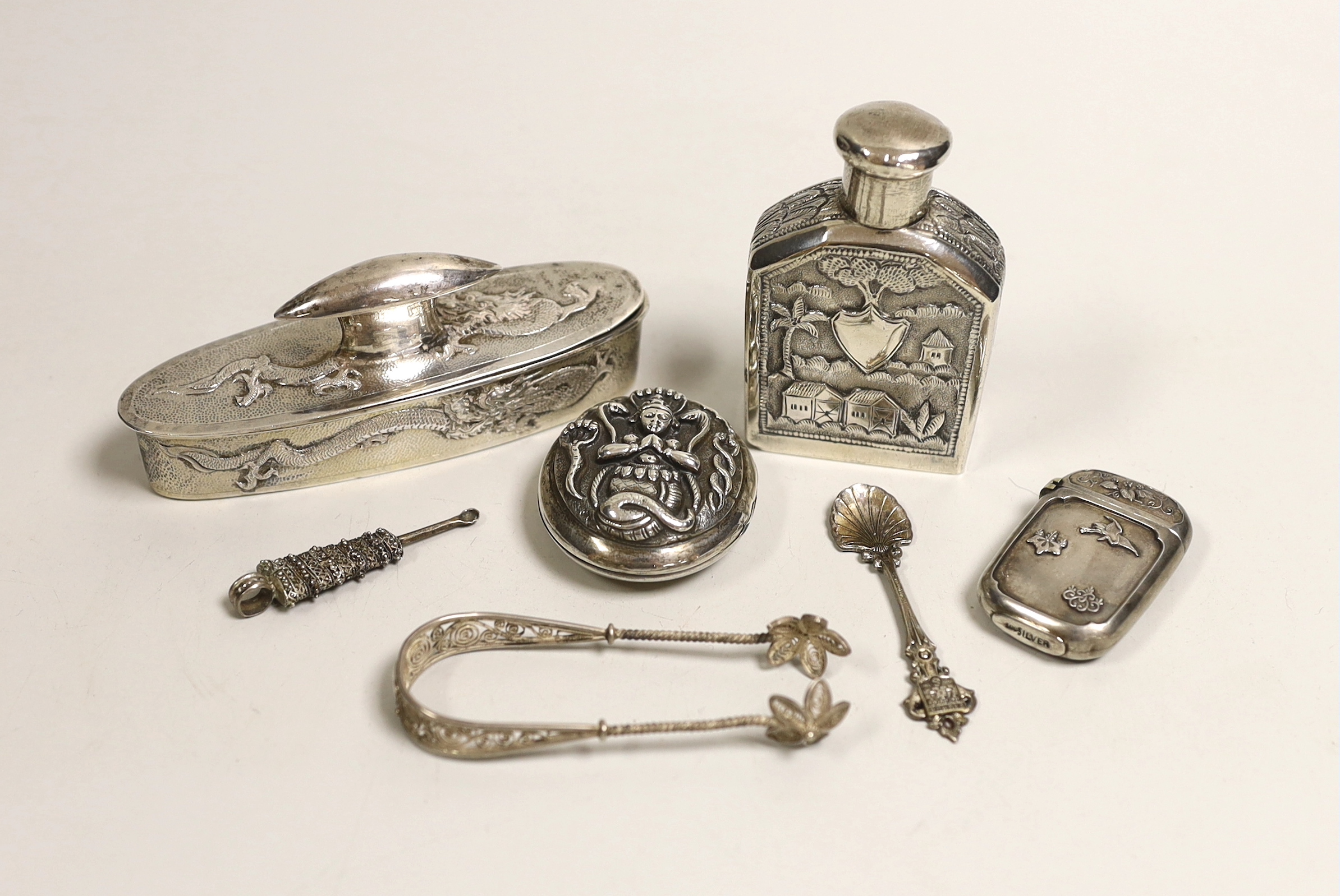 An early 20th century Chinese Export white metal oval box and cover by Wo Sing Lung, Shanghai, 11cm and six other white metal items including Indian scent bottle and oval box.